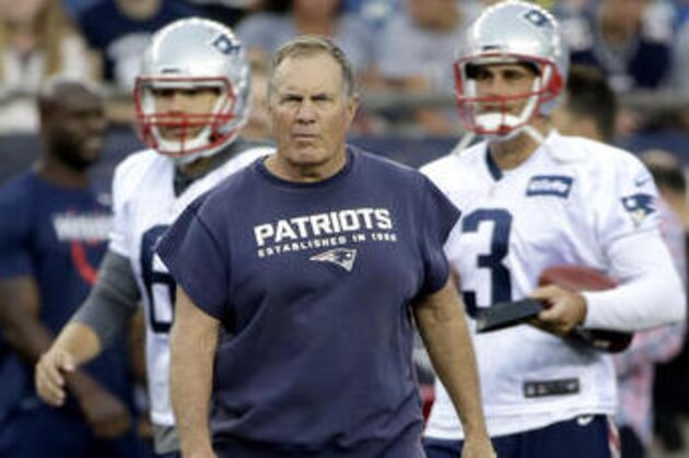 New England Patriots head coach Bill Belichick, center, walks on the field in front of punter Ryan Allen, left, and kicker Stephen Gostkowski, right, during an NFL football training camp practice, Monday, Aug. 1, 2016, in Foxborough, Mass. (AP Photo/Steven Senne)