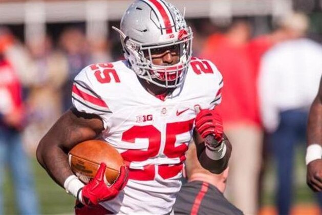 FILE - In this Nov. 14, 2015, file photo, Ohio State running back Bri'onte Dunn (25) warms up before an NCAA college football game against Illinois at Memorial Stadium in Champaign, Ill. Ohio State says its most experienced running back has been kicked off the team for violating the rules. Coach Urban Meyer said in a statement that fifth-year senior Bri'onte Dunn has been dismissed for violating team rules. (AP Photo/Bradley Leeb, File)
