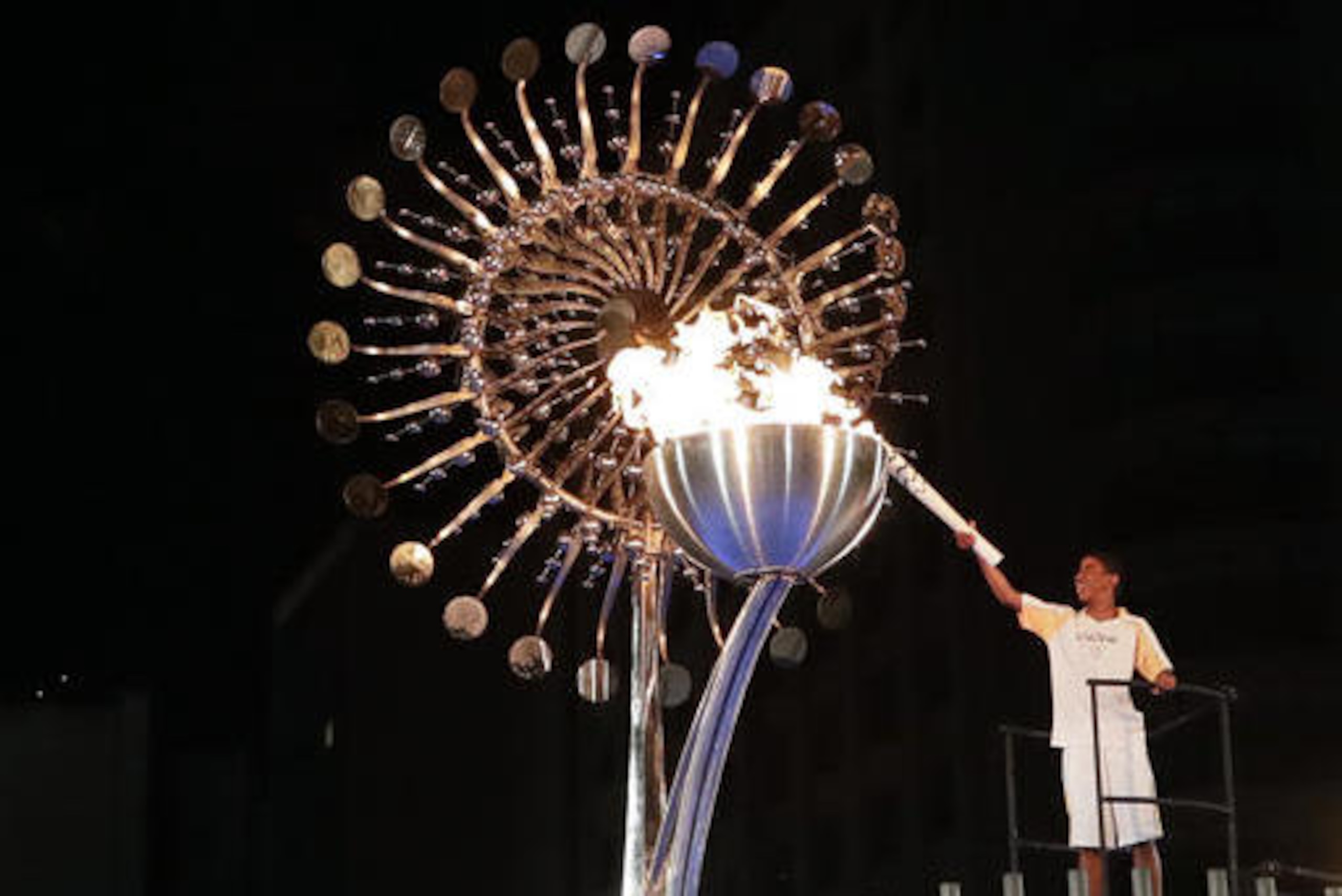 Jorge Alberto Oliveira Gomes lights the Olympic cauldron during the opening ceremony of the 2016 Summer Olympics in Rio de Janeiro, Brazil, Saturday, Aug. 6, 2016. (AP Photo/Gregory Bull)