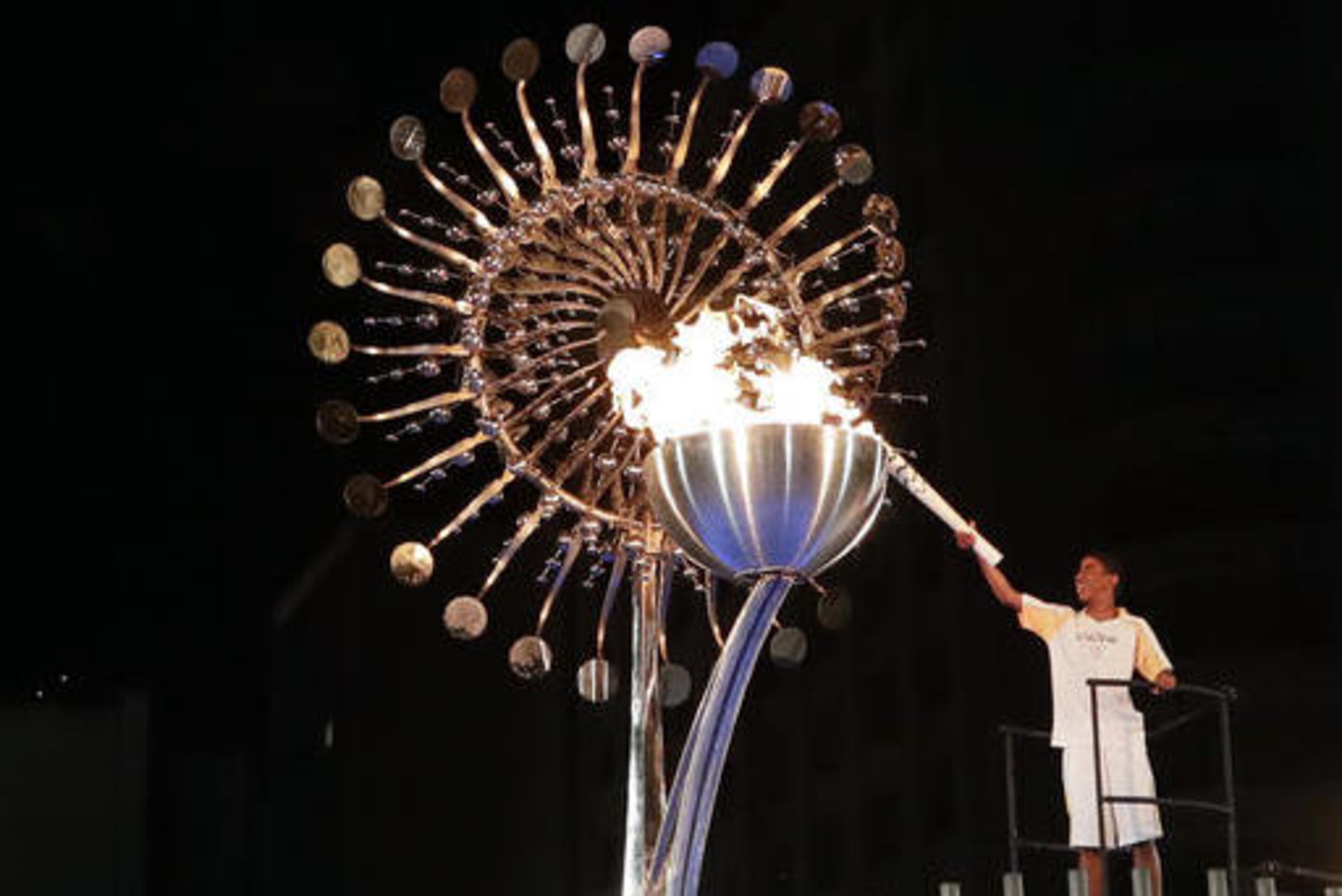 Jorge Alberto Oliveira Gomes lights the Olympic cauldron during the opening ceremony of the 2016 Summer Olympics in Rio de Janeiro, Brazil, Saturday, Aug. 6, 2016. (AP Photo/Gregory Bull)