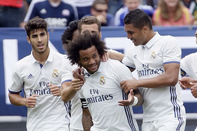 ANN ARBOR, MI - JULY 30:  Marcelo Vieira Da Silva #12 of Real Madrid is surrounded by teammates after scoring against Chelsea during the first half at Michigan Stadium on July 30, 2016 in Ann Arbor, Michigan. (Photo by Duane Burleson/Getty Images)