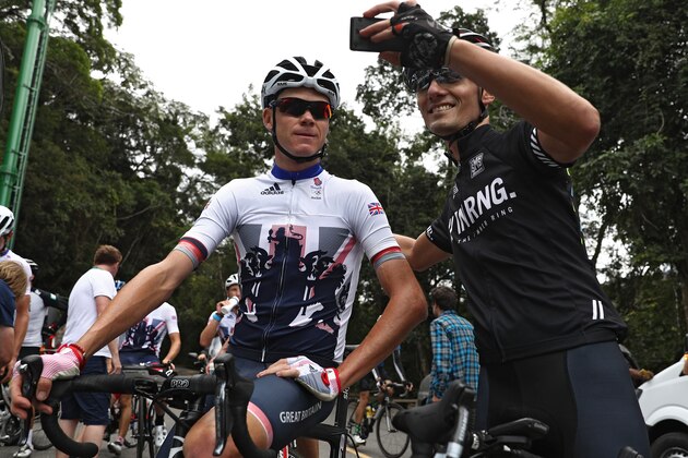 RIO DE JANEIRO, BRAZIL - AUGUST 04: Great Britain cyclist Chris Froome (L) gets his picture taken with another cyclist during training as Rio prepares for the 2016 Summer Olympic Games on August 4, 2016 in Rio de Janeiro, Brazil. (Photo by Patrick Smith/Getty Images)