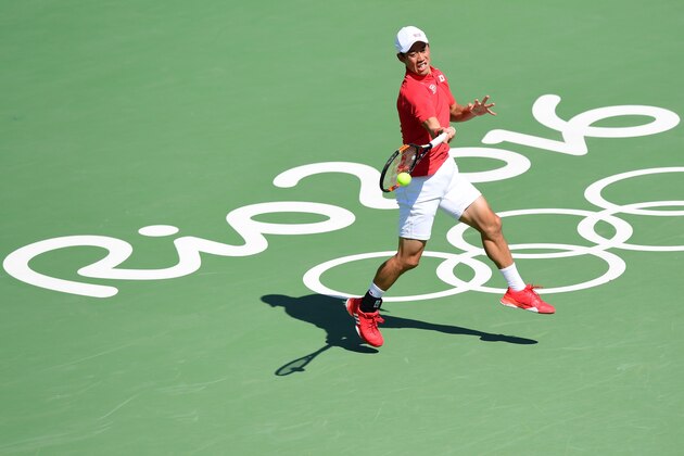 Japan's Kei Nishikori returns the ball to Spain's Alberto Ramos-Vinolas during their men's first round singles tennis match at the Olympic Tennis Centre of the Rio 2016 Olympic Games in Rio de Janeiro on August 6, 2016. / AFP / Martin BERNETTI        (Photo credit should read MARTIN BERNETTI/AFP/Getty Images)