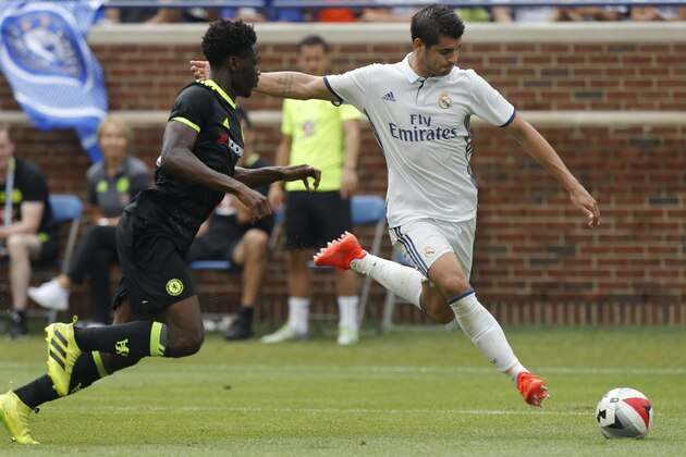 Real Madrid forward Alvaro Borja Morata Martin (R) takes a shot on goal as Chelsea defender Ola Aina (L) defends during an International Champions Cup soccer match in Ann Arbor, Michigan on July 30, 2016. / AFP / Jay LaPrete        (Photo credit should read JAY LAPRETE/AFP/Getty Images)