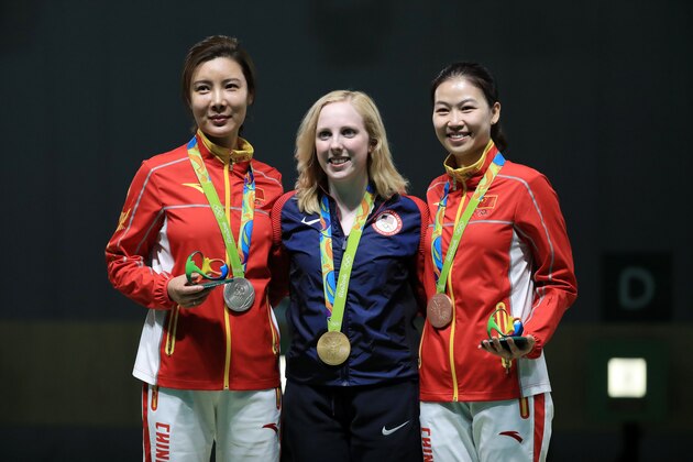 RIO DE JANEIRO, BRAZIL - AUGUST 06:  (L-R) Li Du of China with silver, Virginia Thrasher of the United States with gold and Siling Yi of China with bronze pose on the podium following the Women's 10m Air Rifle  on Day 1 of the Rio 2016 Olympic Games at the Olympic Shooting Centre on August 6, 2016 in Rio de Janeiro, Brazil.  (Photo by Sam Greenwood/Getty Images)
