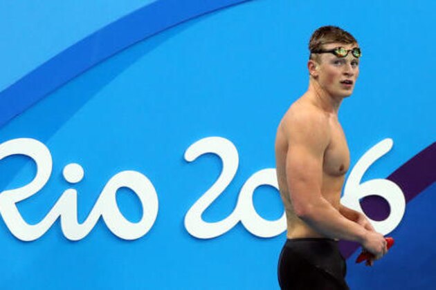 Britain's Adam Peaty leaves the pool area after breaking the world record in a heat of the men's 100-meter breaststroke during the swimming competitions at the 2016 Summer Olympics, Saturday, Aug. 6, 2016, in Rio de Janeiro, Brazil. (AP Photo/Lee Jin-man)