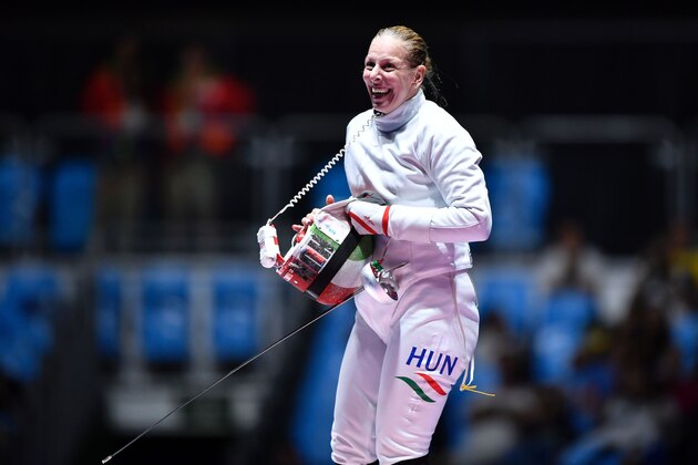 Hungary's Emese Szasz celebrates after  winning  the womens individual epee gold medal bout as part of the fencing event of the Rio 2016 Olympic Games, on August 6, 2016, at the Carioca Arena 3, in Rio de Janeiro.
 / AFP / Fabrice COFFRINI        (Photo credit should read FABRICE COFFRINI/AFP/Getty Images)