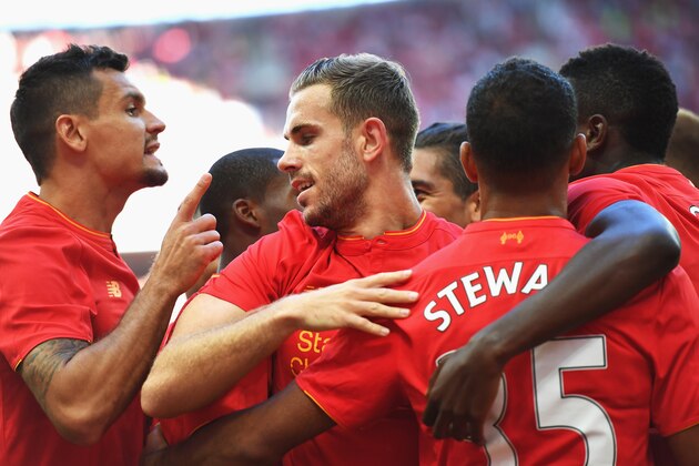 LONDON, ENGLAND - AUGUST 06:  Liverpool players including Jordan Henderson celebrate the third goal scored by Divock Origi of Liverpool during the International Champions Cup match between Liverpool and Barcelona at Wembley Stadium on August 6, 2016 in London, England.  (Photo by Mike Hewitt/Getty Images)