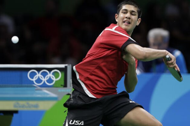 Kanak Jha, of the United States, returns a shot to Nima Alamian, of Iran, during a table tennis match at the 2016 Summer Olympics in Rio de Janeiro, Brazil, Saturday, Aug. 6, 2016. (AP Photo/Petros Giannakouris)