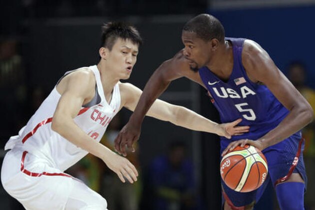 United States' Kevin Durant (5) drives past China's Zou Peng, left, during a basketball game at the 2016 Summer Olympics in Rio de Janeiro, Brazil, Saturday, Aug. 6, 2016. (AP Photo/Charlie Neibergall)