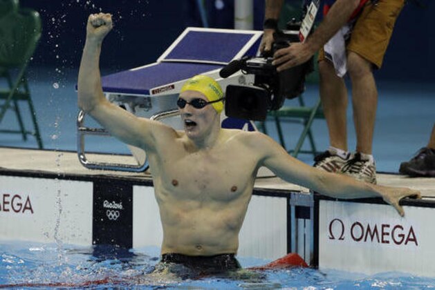 Australia's Mack Horton celebrates winning the gold in the final of the men's 400-meter freestyle during the swimming competitions at the 2016 Summer Olympics, Saturday, Aug. 6, 2016, in Rio de Janeiro, Brazil. (AP Photo/Matt Slocum)