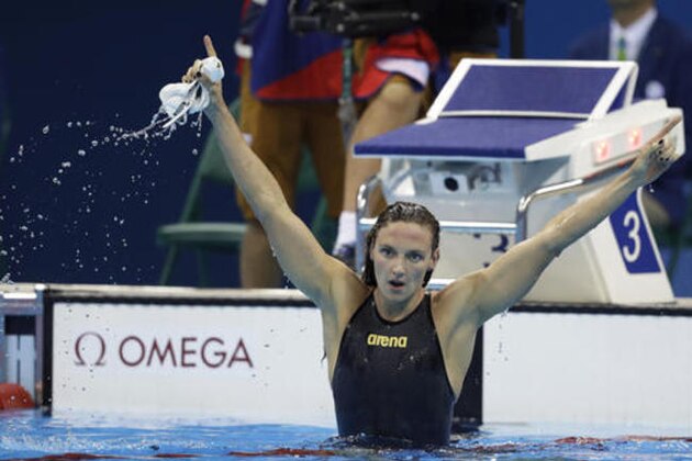 Hungary's Katinka Hosszu celebrates after setting a new world record and winning the gold medal in the women's 400-meter individual medley final during the swimming competitions at the 2016 Summer Olympics, Saturday, Aug. 6, 2016, in Rio de Janeiro, Brazil. (AP Photo/Michael Sohn)