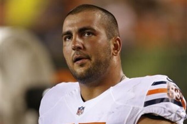 Chicago Bears center Hroniss Grasu (55) stands on the sidelines in the second half of a NFL preseason football game against the Cincinnati Bengals, Saturday, Aug. 29, 2015, in Cincinnati. (AP Photo/Gary Landers)