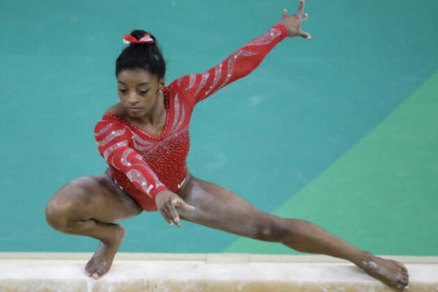 United States' Simone Biles trains on the balance beam ahead of the 2016 Summer Olympics in Rio de Janeiro, Brazil, Thursday, Aug. 4, 2016. (AP Photo/Julio Cortez)