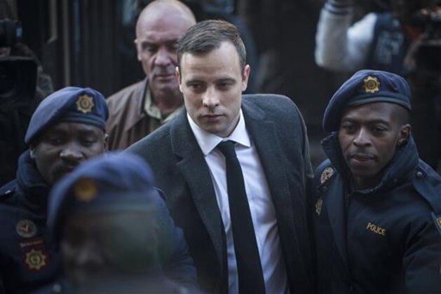Oscar Pistorius, center, arrives at the High Court in Pretoria, South Africa Wednesday, July 6, 2016. A South African judge is expected to announce Pistorius' sentence for murdering girlfriend Reeva Steenkamp in his home on Valentine's Day 2013. (AP Photo/Shiraaz Mohamed)
