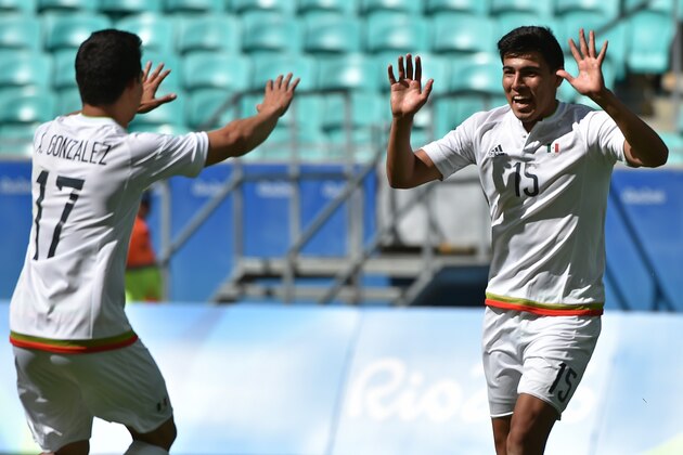 Erick Gutierrez of Mexico celebrates with a teammate after scoring against Fiji during their Rio 2016 Olympic Games mens second round Group C football match, at the Arena Fonte Nova Stadium in Salvador, Brazil on August 7, 2016. / AFP / NELSON ALMEIDA        (Photo credit should read NELSON ALMEIDA/AFP/Getty Images)