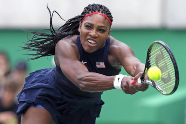 Serena Williams, of the United States, reaches for a return against Daria Gavrilova, of Australia, at the 2016 Summer Olympics in Rio de Janeiro, Brazil, Sunday, Aug. 7, 2016. (AP Photo/Charles Krupa)