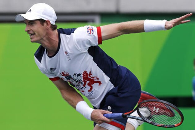 Andy Murray, of England, serves to Viktor Troicki, of Serbia, at the 2016 Summer Olympics in Rio de Janeiro, Brazil, Sunday, Aug. 7, 2016. (AP Photo/Charles Krupa)