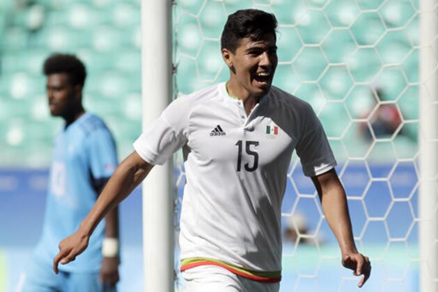Mexico's Erick Gutierrez, right, celebrates his goal during a group C match of the men's Olympic football tournament between Mexico and Fiji at the Fonte Nova Arena in Salvador, Brazil, Sunday, Aug. 7, 2016. Mexico won 5-1. (AP Photo/Arisson Marinho)