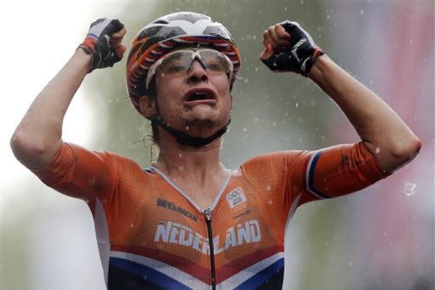 FILE - In this July 29, 2012, file photo, Marianne Vos, left, of The Netherlands, celebrates as she crosses the finish line to win the gold medal in the Women's Road Cycling race at the 2012 Summer Olympics in London. Reigning gold medalist Marianne Vos and fellow Dutchwoman Anna van der Breggen are among the headliners in the women’s field at the Rio Olympics (AP Photo/Christophe Ena, File)