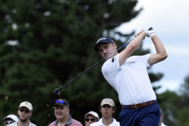 Russell Knox watches his tee shot on the second hole during the final round of the Travelers Championship golf tournament in Cromwell, Conn., Sunday, Aug. 7, 2016. (AP Photo/Fred Beckham)