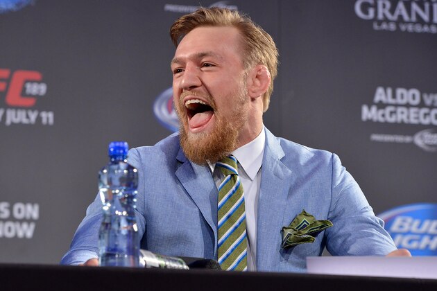 DUBLIN, IRELAND - MARCH 31:  UFC featherweight title challenger Conor 'The Notorious' McGregor of Ireland laughs at UFC Featherweight Champion Jose Aldo during the UFC 189 World Championship Fan Event on March 31, 2015 in Dublin, Ireland. (Photo by Jeff Bottari/Zuffa LLC/Zuffa LLC via Getty Images)
