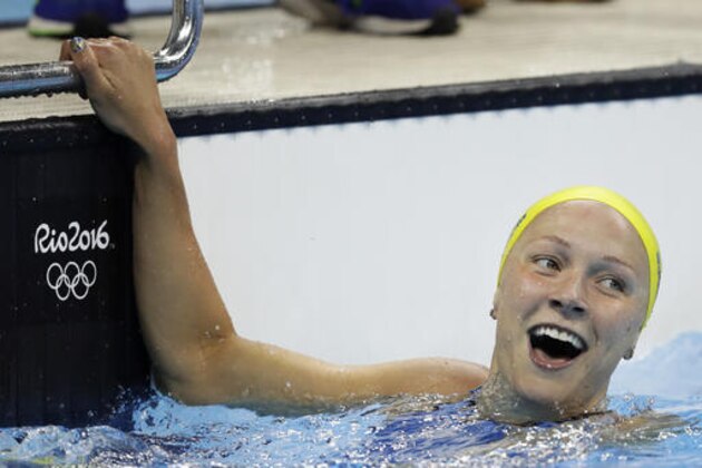 Sweden's gold medal winner Sarah Sjostrom celebrates after setting a new world record in the women's 100-meter butterfly final during the swimming competitions at the 2016 Summer Olympics, Sunday, Aug. 7, 2016, in Rio de Janeiro, Brazil. (AP Photo/Michael Sohn)