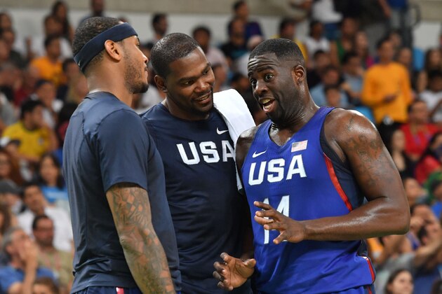 USA's forward Draymond Green (R) talks with USA's guard Kevin Durant (C) within a Men's round Group A basketball match between China and USA at the Carioca Arena 1 in Rio de Janeiro on August 6, 2016 during the Rio 2016 Olympic Games. / AFP / Andrej ISAKOVIC        (Photo credit should read ANDREJ ISAKOVIC/AFP/Getty Images)