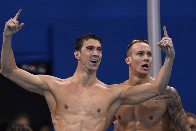 USA's Michael Phelps (L) and USA's Caeleb Dressel cheer as they compete in the Men's 4x100m Freestyle Relay Final during the swimming event at the Rio 2016 Olympic Games at the Olympic Aquatics Stadium in Rio de Janeiro on August 7, 2016.   / AFP / Martin BUREAU        (Photo credit should read MARTIN BUREAU/AFP/Getty Images)