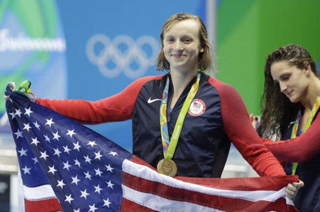 Winner United States' Katie Ledecky, celebrates with her medal after the women's 400-meter freestyle during the swimming competitions at the 2016 Summer Olympics, Monday, Aug. 8, 2016, in Rio de Janeiro, Brazil. (AP Photo/Matt Slocum)