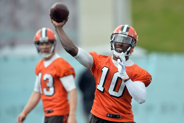 Jun 7, 2016; Berea, OH, USA; Cleveland Browns quarterback Robert Griffin III (10) throws a pass as quarterback Josh McCown (13) watches during minicamp at the Cleveland Browns training facility. Mandatory Credit: Ken Blaze-USA TODAY Sports