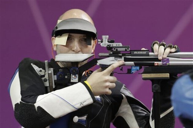 Itally's Niccolo Campriani concentrates between shots during the men's 50-meter rifle 3 positions final at the 2012 Summer Olympics, Monday, Aug. 6, 2012, in London. Campriani won gold in the event and Emmons took home bronze.(AP Photo/Rebecca Blackwell)