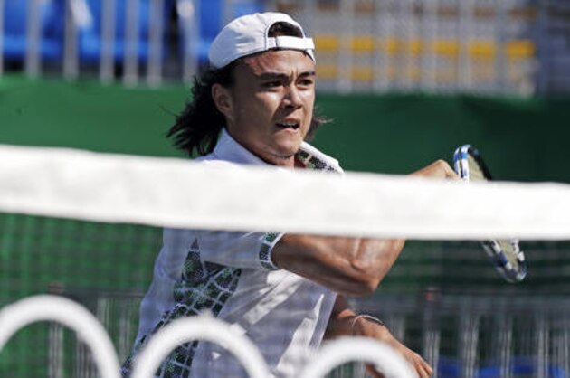 Daniel Taro, of Japan, returns to Jack Sock, of the United States, during the 2016 Summer Olympics in Rio de Janeiro, Brazil, Saturday, Aug. 6, 2016. (AP Photo/Charles Krupa)