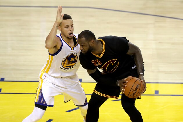 OAKLAND, CA - JUNE 19:  Stephen Curry #30 of the Golden State Warriors defends LeBron James #23 of the Cleveland Cavaliers in Game 7 of the 2016 NBA Finals at ORACLE Arena on June 19, 2016 in Oakland, California. NOTE TO USER: User expressly acknowledges and agrees that, by downloading and or using this photograph, User is consenting to the terms and conditions of the Getty Images License Agreement.  (Photo by Ronald Martinez/Getty Images)