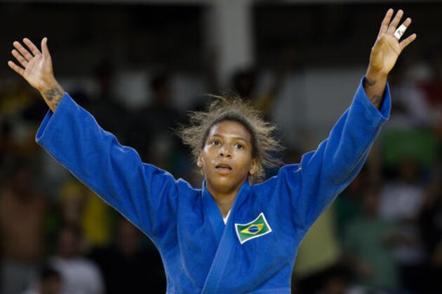 Brazil's Rafaela Silva celebrates after winning the gold medal of the women's 57-kg judo competition at the 2016 Summer Olympics in Rio de Janeiro, Brazil, Monday, Aug. 8, 2016. (AP Photo/Markus Schreiber) Brazil's Rafaela Silva celebrates after winning the gold medal of the women's 57-kg judo competition at the 2016 Summer Olympics in Rio de Janeiro, Brazil, Monday, Aug. 8, 2016. (AP Photo/Markus Schreiber)