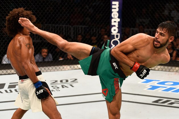 SALT LAKE CITY, UT - AUGUST 06:  (R-L) Yair Rodriguez of Mexico kicks Alex Caceres in their featherweight bout during the UFC Fight Night event at Vivint Smart Home Arena on August 6, 2016 in Salt Lake City, Utah. (Photo by Jeff Bottari/Zuffa LLC/Zuffa LLC via Getty Images)