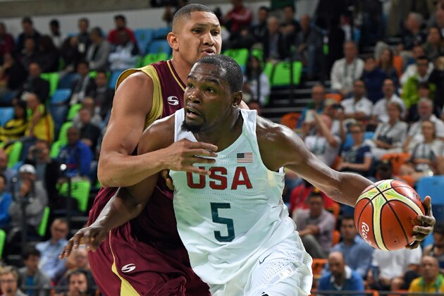 USA's guard Kevin Durant (R) works around Venezuela's centre Miguel Marriaga during a Men's round Group A basketball match between USA and Venezuela at the Carioca Arena 1 in Rio de Janeiro on August 8, 2016 during the Rio 2016 Olympic Games. / AFP / Mark RALSTON        (Photo credit should read MARK RALSTON/AFP/Getty Images)
