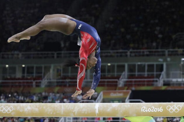 United States' Simone Biles performs on the balance beam during the artistic gymnastics women's qualification at the 2016 Summer Olympics in Rio de Janeiro, Brazil, Sunday, Aug. 7, 2016. (AP Photo/Rebecca Blackwell)