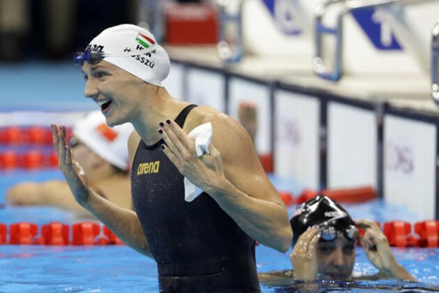 Hungary's Katinka Hosszu celebrates winning the gold medal in the women's 100-meter backstroke during the swimming competitions at the 2016 Summer Olympics, Monday, Aug. 8, 2016, in Rio de Janeiro, Brazil. (AP Photo/David J. Phillip)