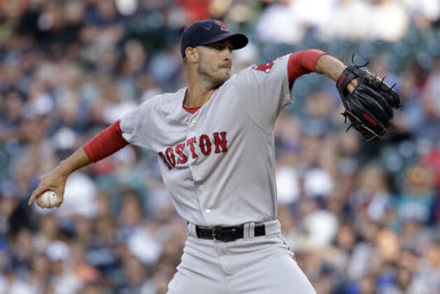 Boston Red Sox starting pitcher Rick Porcello throws to a Seattle Mariners batter during the first inning of a baseball game Wednesday, Aug. 3, 2016, in Seattle. (AP Photo/Elaine Thompson)