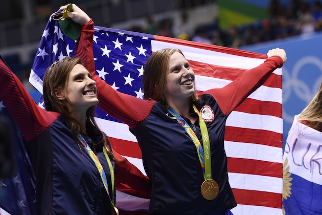 USA's Lilly King (R) poses with bronze medallist USA's Katie Meili on the podium after she won the Women's 100m Breaststroke Final during the swimming event at the Rio 2016 Olympic Games at the Olympic Aquatics Stadium in Rio de Janeiro on August 8, 2016.   / AFP / CHRISTOPHE SIMON        (Photo credit should read CHRISTOPHE SIMON/AFP/Getty Images)