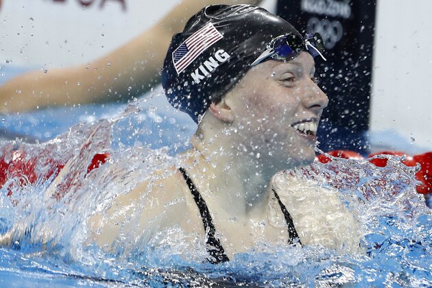 USA's Lilly King celebrates after she broke the Olympic record to win the Women's 100m Breaststroke Final during the swimming event at the Rio 2016 Olympic Games at the Olympic Aquatics Stadium in Rio de Janeiro on August 8, 2016.   / AFP / Odd Andersen        (Photo credit should read ODD ANDERSEN/AFP/Getty Images)