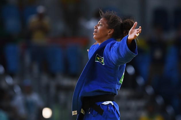 RIO DE JANEIRO, BRAZIL - AUGUST 08:  Rafaela Silva of Brazil celebrates after defeating Sumiya Dorjsuren of Mongolia in the Women's -57 kg Final - Gold Medal Contest on Day 3 of the Rio 2016 Olympic Games at Carioca Arena 2 on August 8, 2016 in Rio de Janeiro, Brazil.  (Photo by David Ramos/Getty Images)