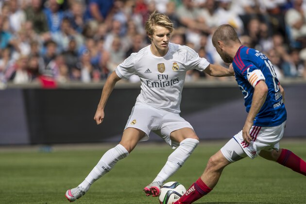 OSLO, NORWAY - August 9: Martin Odegaard  of Real Madrid, Christian Grindheim of Vaalerenga  during  Pre-season Friendly  match between Vaalerenga and Real Madrid at Ullevaal Stadion on August  9, 2015 in Oslo, Norway.  (Photo by Trond Tandberg/Getty Images)
