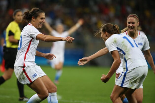 United States's Carli Lloyd, left, celebrates her goal with teammates during a group G match of the women's Olympic football tournament between United States and France at the Mineirao stadium in Belo Horizonte, Brazil, Saturday, Aug. 6, 2016. (AP Photo/Eugenio Savio)