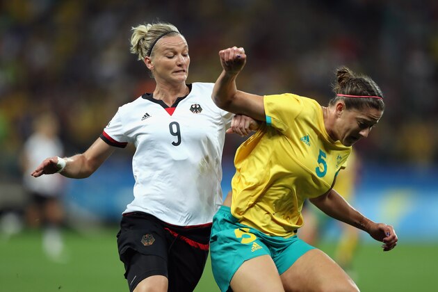SAO PAULO, BRAZIL - AUGUST 06:  Alexandra Popp #9 of Germany and Laura Alleway #5 of Australia battle for position during the first half in the Women's First Round Group F match at Arena Corinthians on August 6, 2016 in Sao Paulo, Brazil.  (Photo by Alexandre Schneider/Getty Images)