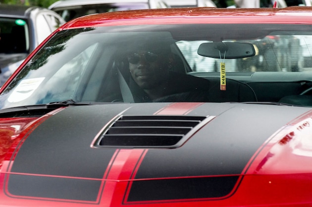 French footballer Paul Pogba (L) arrives in a convoy of vehicles at Manchester United's Carrington training complex, in Manchester, north west England on August 8, 2016. 
France midfielder Paul Pogba arrived in Manchester on August 8 to complete his record-breaking transfer to Manchester United from Juventus, British media reported. Sky Sports News said the 23-year-old had flown to Manchester from Nice in a private jet and would undergo a medical at United's Training Complex. 
 / AFP / OLI SCARFF        (Photo credit should read OLI SCARFF/AFP/Getty Images)