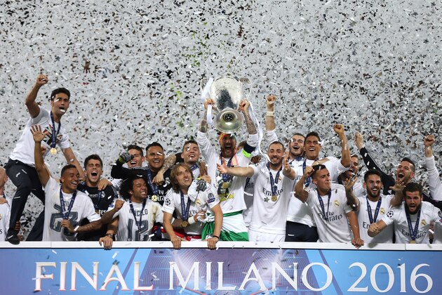 MILAN, ITALY - MAY 28: Sergio Ramos of Real Madrid lifts the trophy following the UEFA Champions League Final between Real Madrid and Club Atletico de Madrid at Stadio Giuseppe Meazza on May 28, 2016 in Milan, Italy. (Photo by Chris Brunskill Ltd/Getty Images)