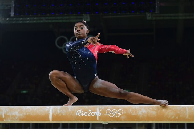 US gymnast Simone Biles competes in the qualifying for the women's Beam event of the Artistic Gymnastics at the Olympic Arena during the Rio 2016 Olympic Games in Rio de Janeiro on August 7, 2016. / AFP / Emmanuel DUNAND        (Photo credit should read EMMANUEL DUNAND/AFP/Getty Images)