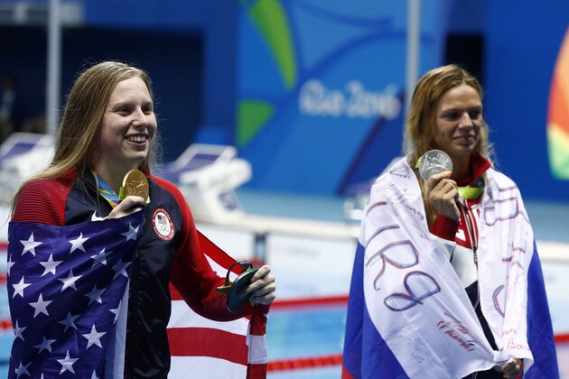 USA's Lilly King (L) poses with her gold medal next to silver medallist Russia's Yulia Efimova after she won the Women's 100m Breaststroke Final during the swimming event at the Rio 2016 Olympic Games at the Olympic Aquatics Stadium in Rio de Janeiro on August 8, 2016.   / AFP / Odd ANDERSEN        (Photo credit should read ODD ANDERSEN/AFP/Getty Images)